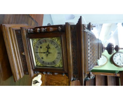 A quarter striking table clock, circa 1890, the pagoda top with turned finials, side sound fret doors, 7-inch dial, twin barr
