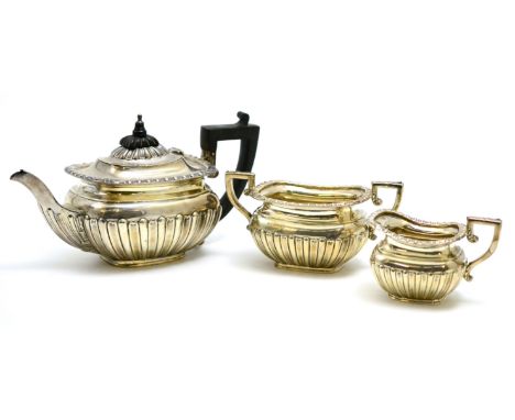 A silver three piece bachelor's tea service, Birmingham hallmark  CONDITION REPORT: Lid of teapot loose, worn marks