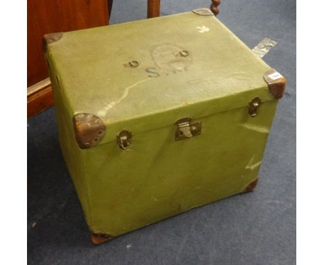 An old green canvas cabin trunk, two suitcases and another travelling trunk (4).