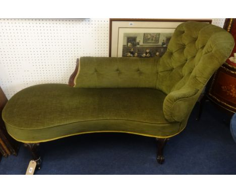 A Victorian mahogany framed Chaise Longue, upholstered in green fabric with button back decoration and small brass castors.