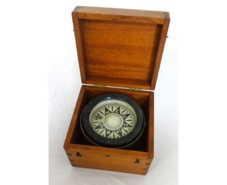 A marine compass in later mahogany box.