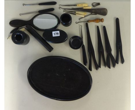 Ebony dressing table set and eleven assorted button hooks.