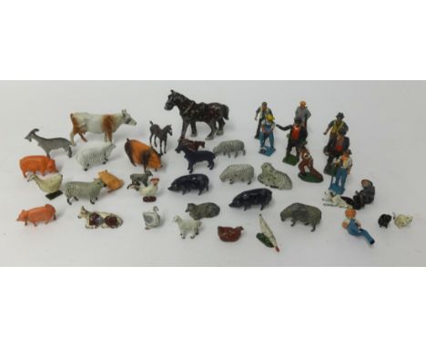 A collection of Dinky farmyard lead figures and diecast farmyard models including police car.
