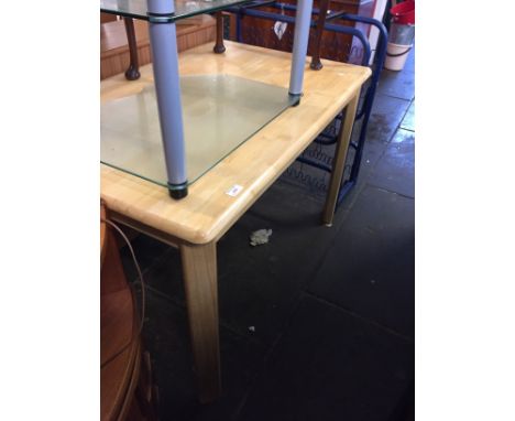 A LIGHT WOOD DINING TABLE