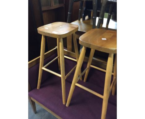A PAIR OF MODERN LIGHT WOOD BAR STOOLS