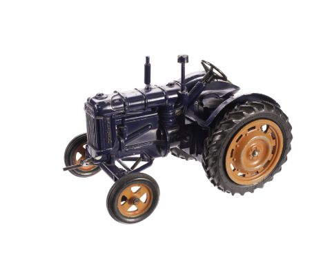 A Chad Valley Clockwork Fordson Major Tractor, in royal blue, G, paint loss to mudguards and towing bar 