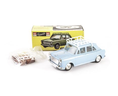 A Telsalda plastic Morris 1100, in light blue with roof rack together with luggage in original plastic bag, in original box, 