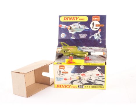 A Dinky Toys 351 U.F.O Interceptor, light metallic green body, black missile holder, blue canopy, red legs, in original card 