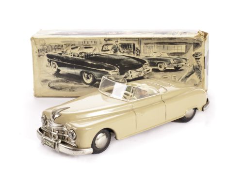 An Arnold US Zone 4500 Tinplate Friction Drive Cadillac, in light tan with cream and green seats with driver, in original box