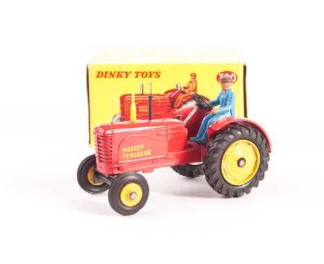 A Dinky Toys 300 Massey-Harris Tractor, red body, yellow cast and plastic hubs, blue plastic driver, ‘Massey-Ferguson’ decals