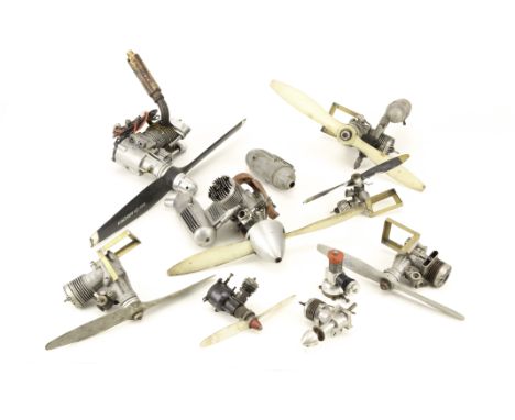A collection of small internal combustion engines by various makers: including an OS Max FP40, with propellor and silencer, a
