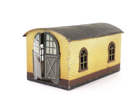 A single-track 0 Gauge Engine Shed by Bing: in buff/maroon finish and grey corrugated roof, with ‘BW Bavaria’ trademark on se