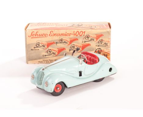 A Schuco US Zone Examico 4001, in light blue, in original box, VG-E, box G clockwork motor  tested well at time of cataloguin
