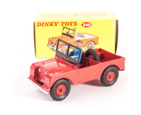 A Dinky Toys 340 Land Rover, red body and interior, red plastic hubs, blue plastic driver, in original light yellow box, clea