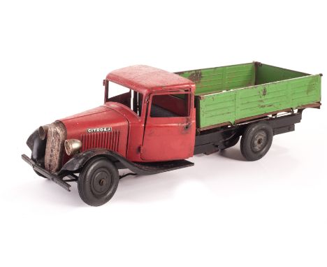 A CIJ pressed steel clockwork Citroën Tipper Lorry, with red cab, green tinplate back with opening sides and wooden deck and 