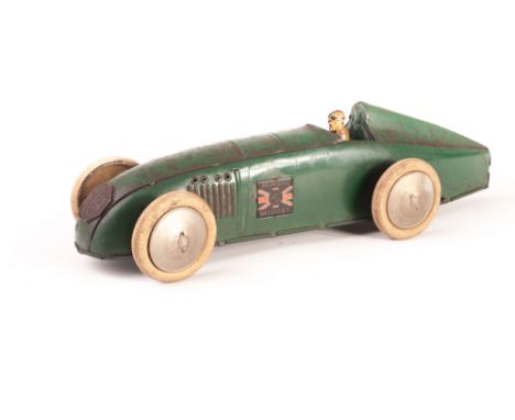A Tri-ang Tinplate Magic MG Midget, clockwork Midget in British Racing Green, F, one wheel loose, some areas of light corrosi