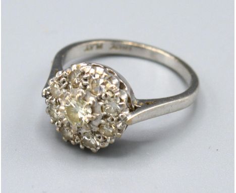 An 18ct. Gold Diamond Cluster Ring set with many diamonds within a pierced setting, 3.5 gms. ring size L 