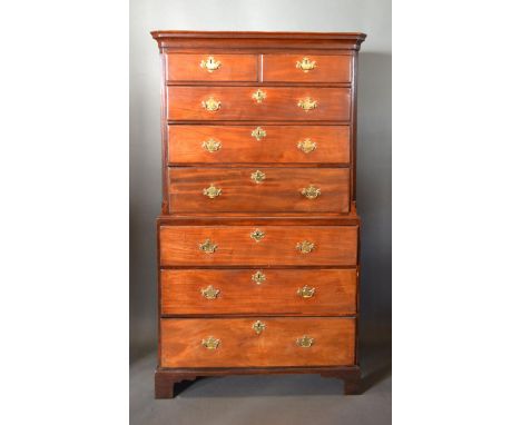 A George III Mahogany Chest on Chest, the moulded cornice above two short and six long graduated drawers with brass handles a