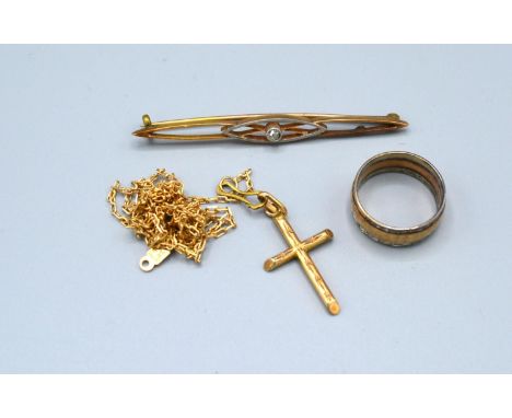 A 9ct. Gold Bar Brooch with Solitaire Diamond together with a 9ct. gold crucifix, a band ring and a 14ct. gold linked neck ch