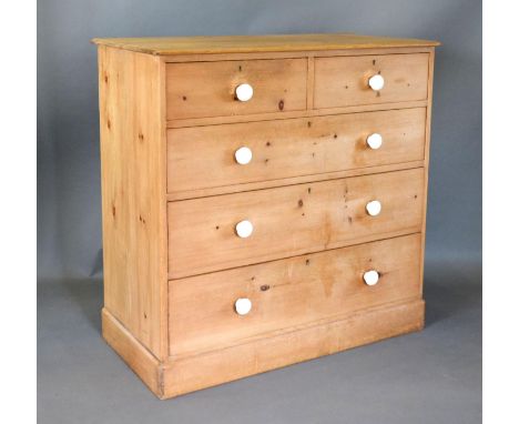 A Pine Straight Front Chest of two short and three long drawers with ceramic handles raised upon a plinth, 107 cms wide, 53 c