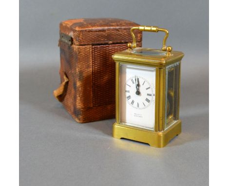 A French Brass Cased Miniature Carriage Clock, the enamel dial with Roman numerals and inscribed Hallett Hastings with lever 