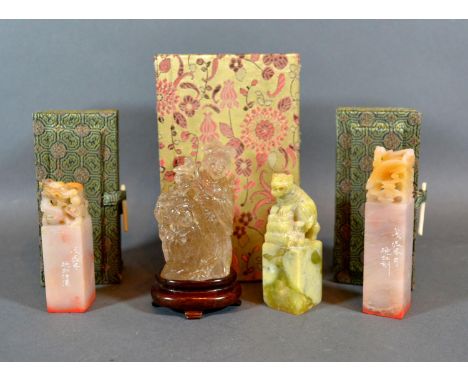 A Chinese Rock Crystal Group with hardwood stand and original box together with a pair of Chinese soap stone seals with boxes