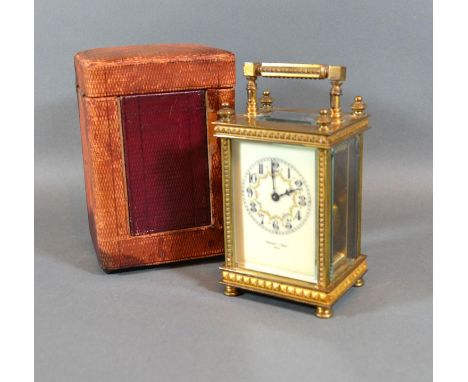 A 19th Century Brass Cased Carriage Clock, the enamel dial with Arabic numerals and inscribed Pearce &amp; Sons, Paris, with 