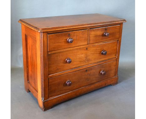 A Victorian Mahogany Chest, the moulded top above two short and two long drawers with knob handles, raised upon bracket feet,
