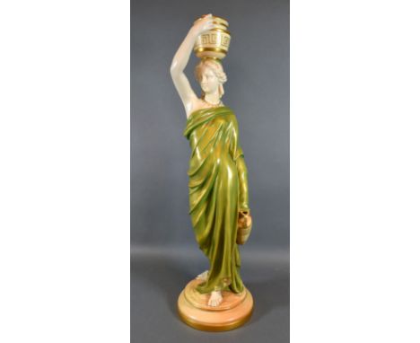 A Royal Worcester Porcelain Figure 'The Water Carrier' puce mark to base and numbered 125, 51 cms tall 