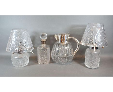 A Cut Glass and Silver Mounted Decanter together with two cut glass lamps and shades and a silver plated and cut glass water 