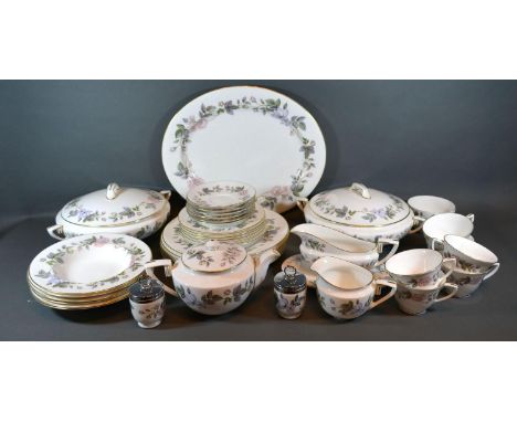 A Royal Worcester June Garland Pattern Part Tea and Dinner Service comprising tureens, platters, plates, teacups and saucers,