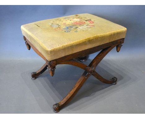 A William IV Rosewood Crossover Stool the tapestry seat above a tulip carved frieze raised upon outswept legs 56cm x 44cm x 4