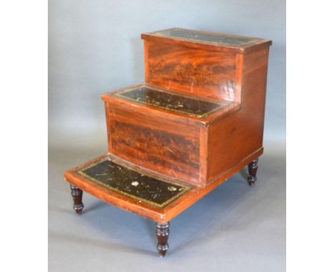 A Mahogany Library Step with green tooled leather steps and turned tapering legs, 50 cms wide, 67 cms deep, 64 cms high 