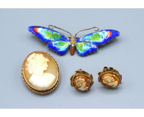 An Oval Cameo Brooch within 9ct. gold mount together with a pair of 9ct. gold cameo ear studs and a silver enamel decorated b