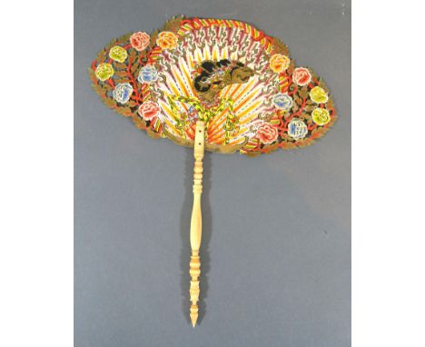 A Late 19th Century Wayang Shadow Puppet Dance Fan with hand painted and gilded leaf and carved bone handle 30 cm long 