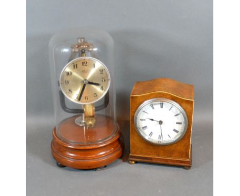 A Bulle electric Clock with Glass Dome and turned wooden stand together with a walnut cased mantle clock 