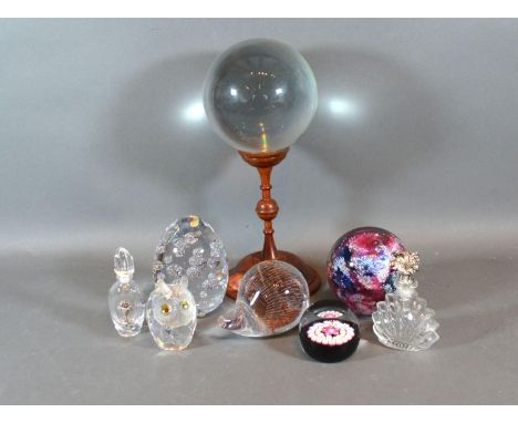 A Caithness Millefiori Glass Paperweight together with three other paperweights, two glass scent bottles, A Swarovski Model o