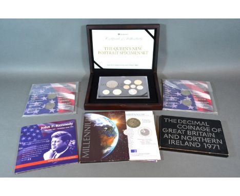 The Queen's New Portrait Specimen Set Presentation Edition limited to 995 together with various other commemorative coins wit