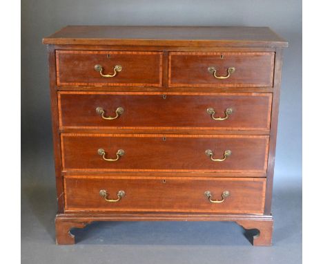 An Edwardian Mahogany Satinwood Inlaid Chest of two short and three long drawers with brass swan neck handles, raised upon br