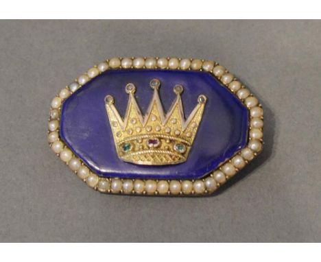 A 19th Century Yellow Metal Brooch of hexagonal form set with a crown on blue enamel with two emeralds and rubies surrounded 
