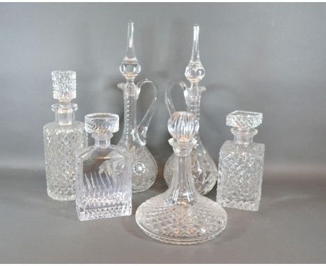 A Pair Of Cut Glass Decanters together with a cut glass ships decanter and three other glass decanters 