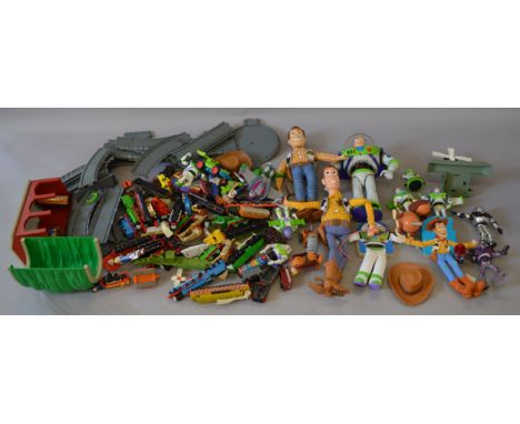 A good mixed lot of loose toys including 'Toy Story' figures, ERTL 'Thomas The Tank Engine' models and track, Beyblades and m