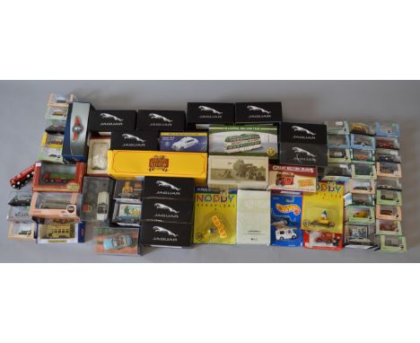 A quantity of boxed and carded diecast models in a variety of  different scales by Atlas Editions, ERTL, Oxford and others in