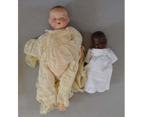 Armand Marseille bisque-headed baby doll. Head impressed to rear A.M Germany 351. / 8.K Sleeping eyes stuck shut. Composition