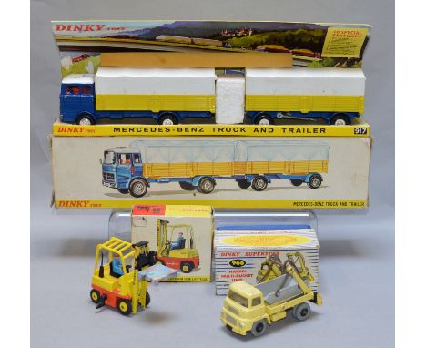 Three boxed Dinky Toys diecast model trucks, a 917 Mercedes Benz Truck and Trailer, F/G but with one broken door mirror, on a