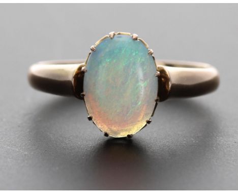 Yellow gold cabouchon opal claw set ring, 0.90ct approx, 2.4gm, 11mm x 9mm, ring size K/L ** with box-no hallmark, test as 15