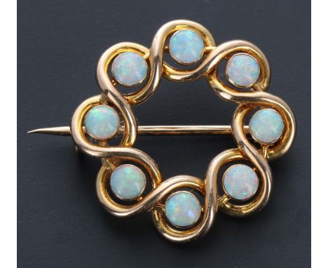 Attractive 15ct circular opal set openwork brooch, set with eight cabouchon opals, 3.5gm, 25mm 