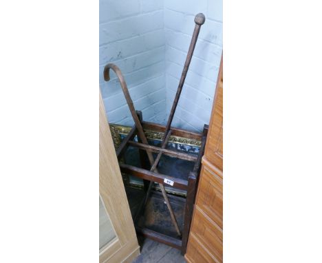 Old stick stand with 2 sticks and a picture firescreen