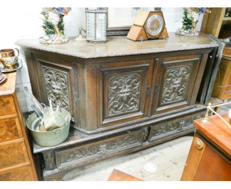Late Victorian carved oak panel sideboard with shaped top above deep base above deep base fitted drawers with lion mask carvi