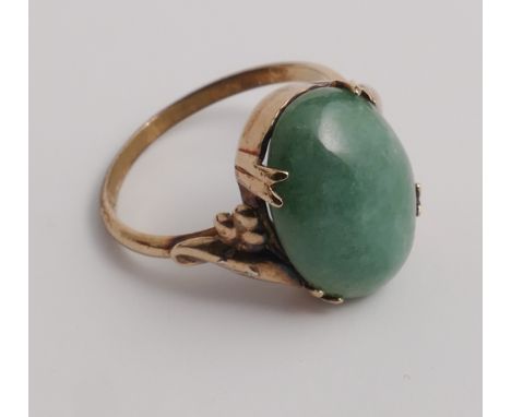 Oval Jade dress ring, claw set on 9ct gold shank. Size K 1/2